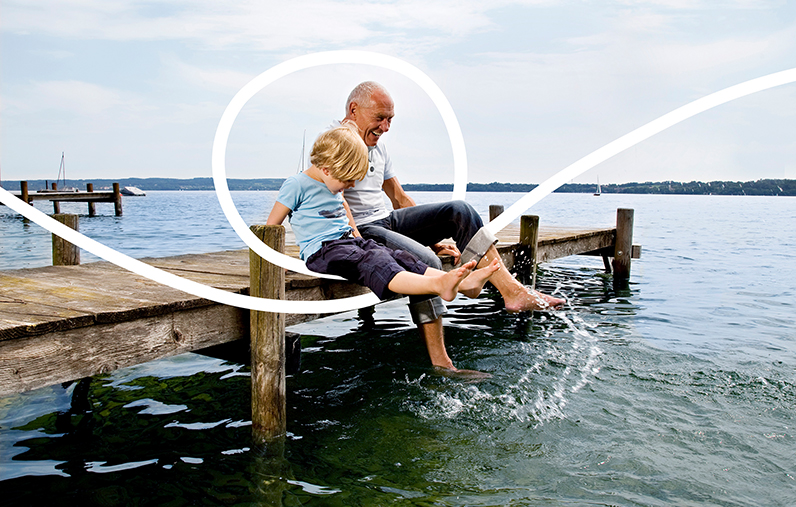 Grandfather on Dock wearing Mobile Personal Emergency Response System (PERS)